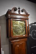 An 18th Century and later oak long case clock having 8 day movement and brass dial , named Fearnly ,