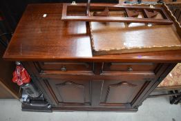 A mahogany fronted drop down fold out bed