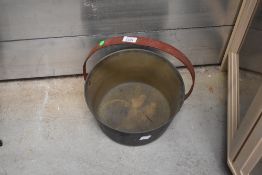 A vintage brass cast jam pan