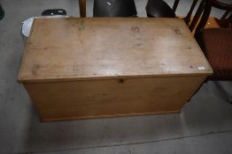 A 20th century stripped pine bedding box with candle section