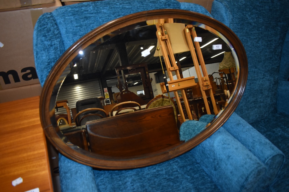 An early 20th Century oval wall mirror