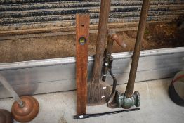 A selection of various tools including large pitch pine butter or cream pat