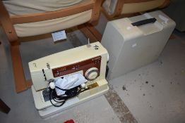 A vintage electric sewing machine by Singer