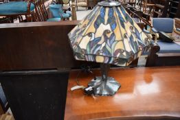 A tiffany style leaded light side or table lamp