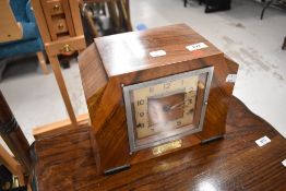 An early 20th Century mantel clock having presentation engraving to label , Tom Kelly, Rathmell