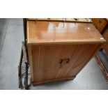 A 20th century light oak utility cupboard