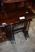 An early 20th century mahogany next of tables, on fine legs