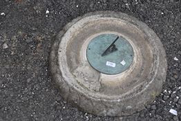 A concrete sundial top, and dial