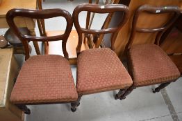 Three Victorian mahogany framed balloon back dining chairs