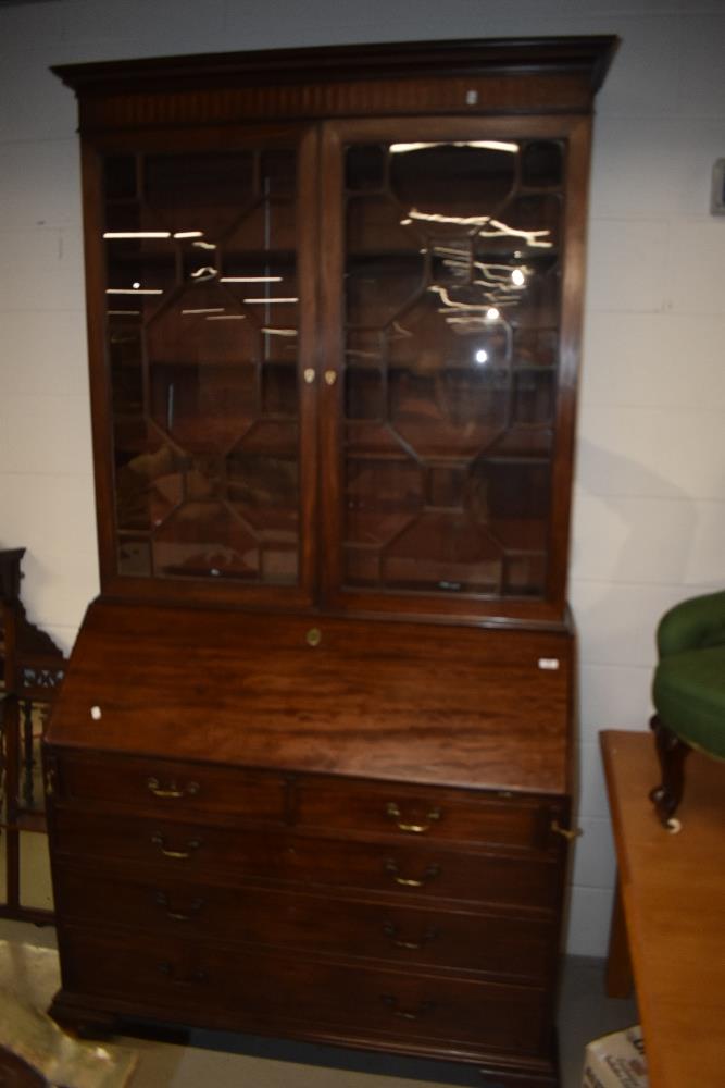 A 19th Century mahogany bureau bookcase, the upper section having wooden shelves behind astral