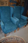 Two modern wing back chairs in teal upholstery