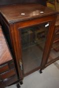 A late 19th or early 20th Century mahogany narrow display cabinet
