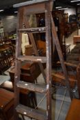 A set of traditional wooden step ladders