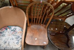 A traditional hoop backed dining chair with yew wood seat