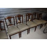 A set of six 19th Century mahogany salon/dining chairs having later upholstered seats and turned