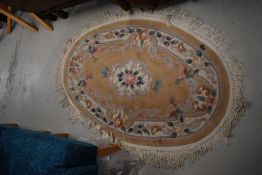 A modern Chinese rug, oval, approx. 130 x 80cm