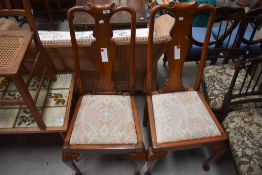 A pair of early 20th Century Queen Anne Style vase back dining chairs with later upholstery