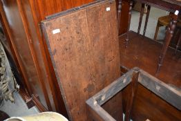 An oak drop leaf or extending table in need of restoration