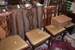 A set of four Chippendale style dining chairs having drop in dralon seats