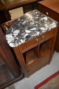 An early 20th Century bedside cabinet having marble top