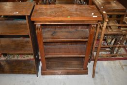 A Victorian style mahogany and walnut low bookcase