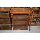 A Victorian style mahogany and walnut low bookcase