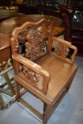 An Oriental hardwood carver chair