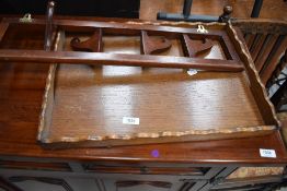 An Edwardian fold out hook rack and an oak butlers tray