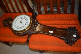 A traditional barometer, oak case, missing thermometer dial