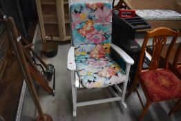 A traditional painted rocking chair