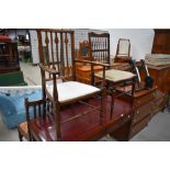 Two Victorian salon style chairs one having turned and shaped frame and the other with spindle