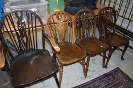 A set of four (three plus one) wheel back dining chairs, From the estate of the late Cedric