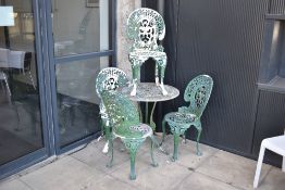 A modern aluminium cast garden table and chair set