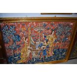 A large gilt framed woolwork tapestry depicting classical maidens and minstral