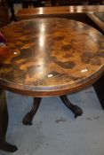 A Victorian walnut loo table on shaped legs