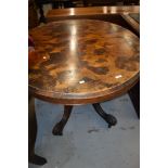 A Victorian walnut loo table on shaped legs