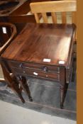 A 19th Century mahogany night stand on turned legs