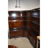 A set of reproduction Regency bookcases/wall units including corner section