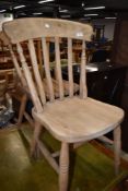 A pair of traditional beech kitchen chairs