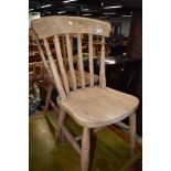 A pair of traditional beech kitchen chairs