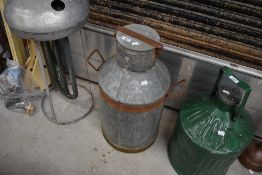 A vintage galvanised milk churn