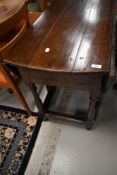 A period oak gateleg table, having turned frame, width approx. 122cm