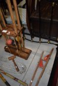 A vintage croquet set including oak mallet stand