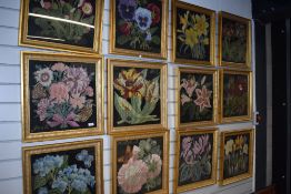 A set of twelve framed floral tapestry works, in gilt frames