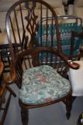 A reproduction stained frame Windsor style arm chair