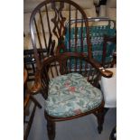 A reproduction stained frame Windsor style arm chair