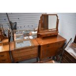 An arts and crafts made dressing table in light oak with a similar chest of three drawers