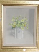 An oil painting on board, Audrey Johnson, still life primulas, signed and dated 1976, 29 x 19cm,