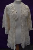 A very decadent cream silk and lace late Victorian/Edwardian bed jacket.