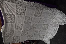 A late 19th early 20th century white bed throw having embroidered and crotchet panels.